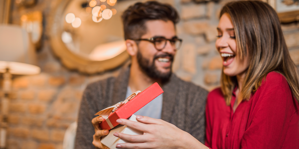 Girlfriend receiving a gift from boyfriend